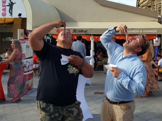 The official First Herring on Aruba was presented to local fisherman Arthur Giel